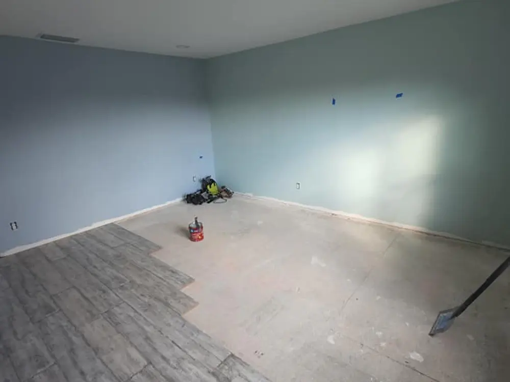 Interior room with flooring and finish work in progress